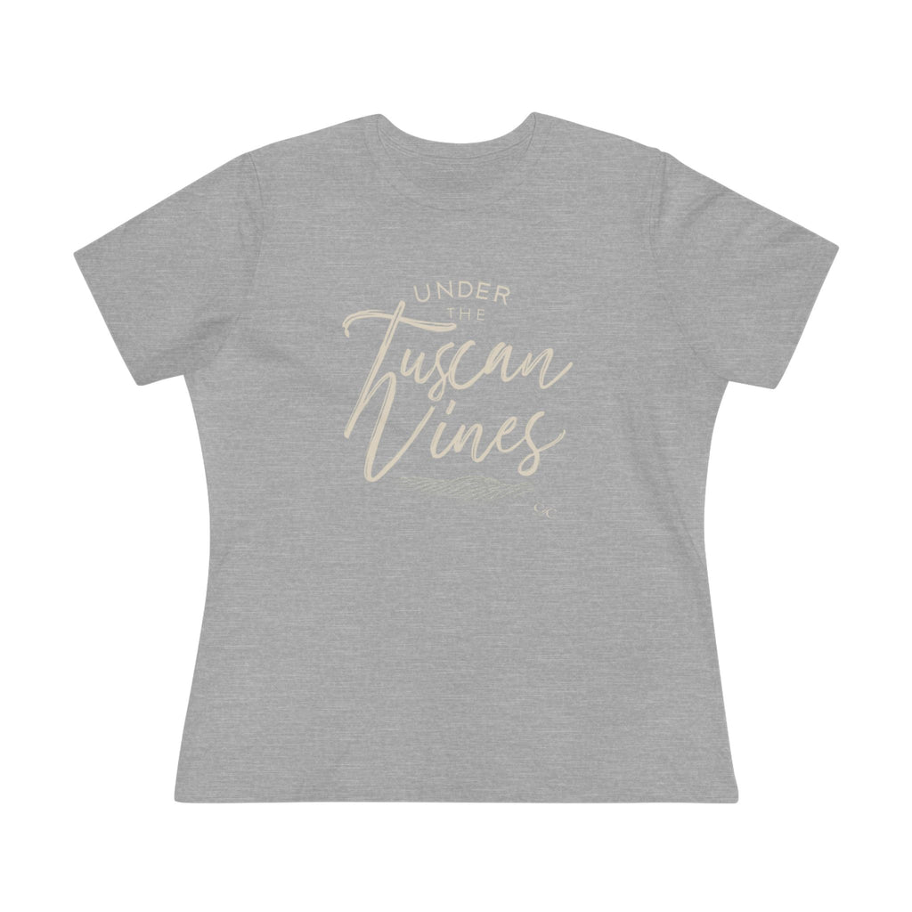 Flat lay of a women’s athletic heather cotton tee with the phrase “Under the Tuscan Vines” in elegant script across the chest.