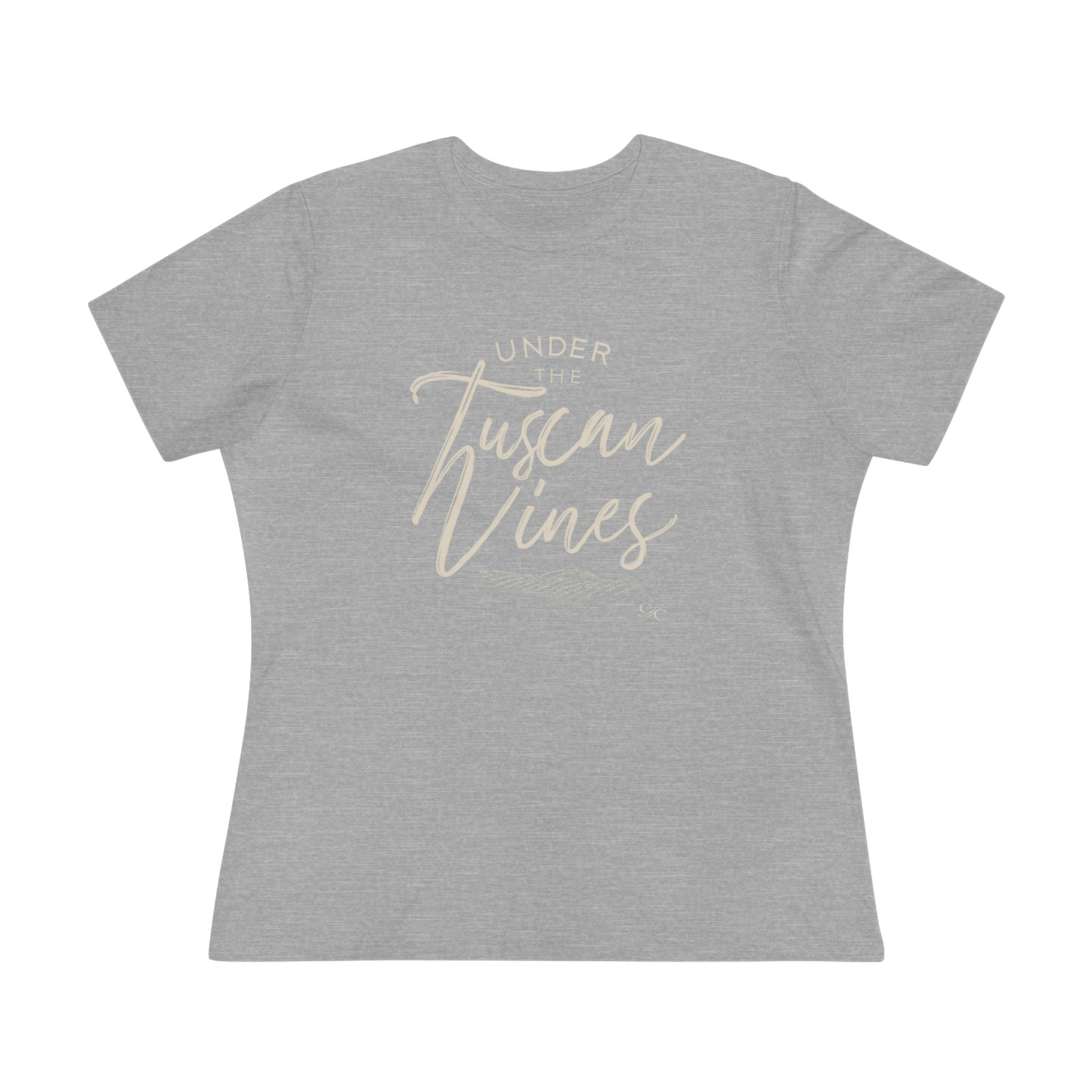 Flat lay of a women’s athletic heather cotton tee with the phrase “Under the Tuscan Vines” in elegant script across the chest.